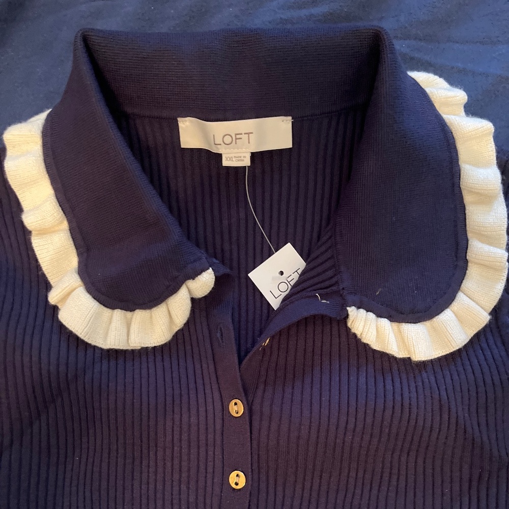 Navy sweater with collar and sleeve details